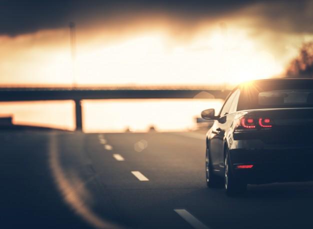 the-back-of-a-car-driving-down-a-motorway