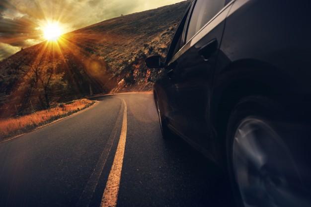 car_driving_down_a_windy_road