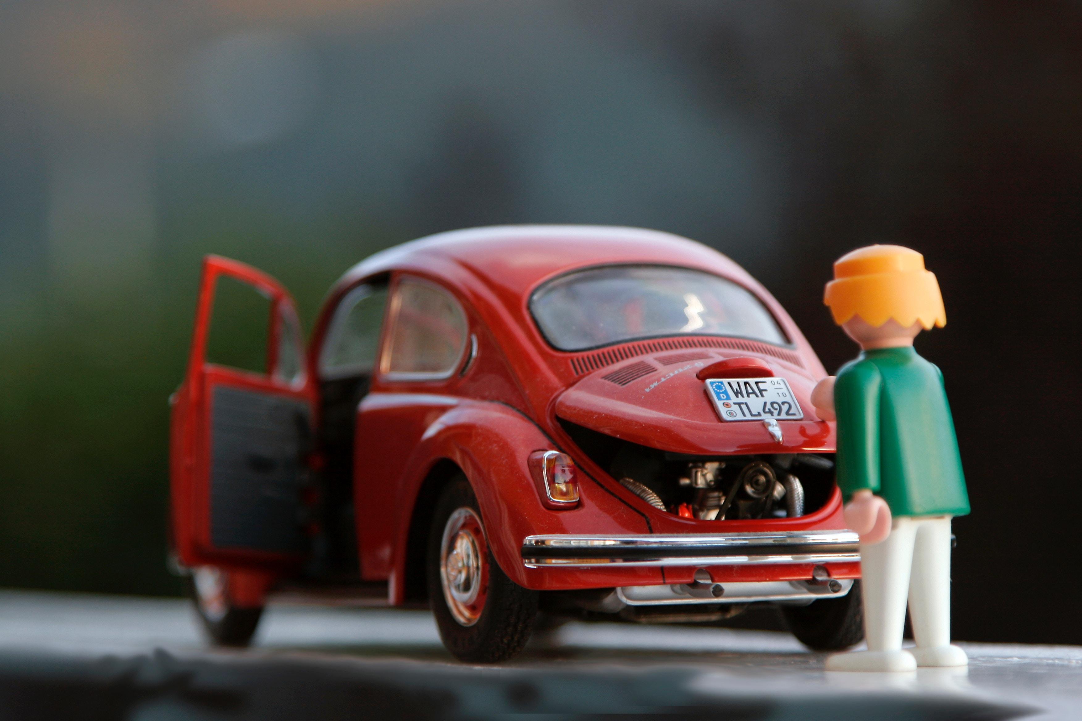 toy_figures_of_a_woman_and_vw_beetle