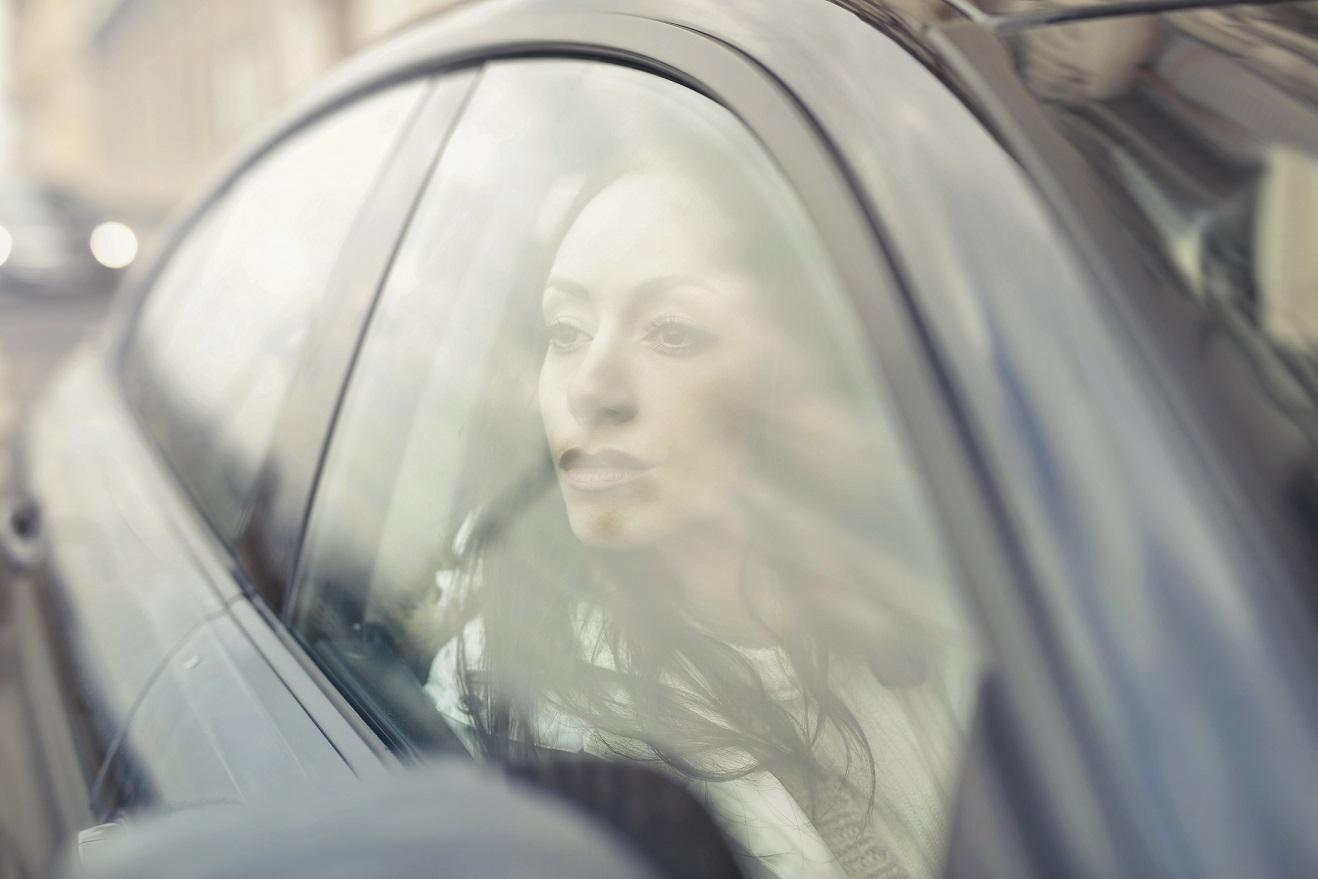 image_of_a_lady_in_the_driving_seat_of_a_car