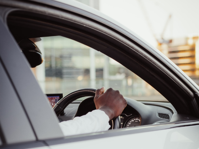 man_at_the_wheel_of_a_private_vehicle