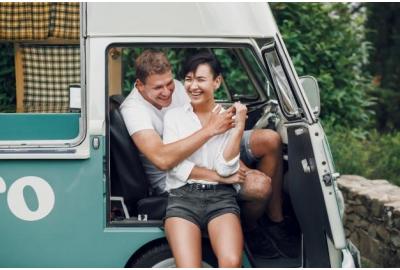 couple_hugging_in_the_doorway_of_a_campervan