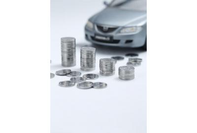 coins_piled_up_infront_of_a_miniature_toy_car