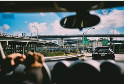 drivers_seat_view_of_a_highway_leading_to_miami