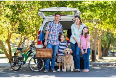 nuclear_family_posing_for_a_photo_outdoors