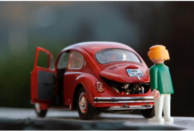 toy_figures_of_a_woman_and_vw_beetle