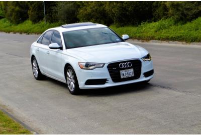 audi_driving_along_a_racetrack