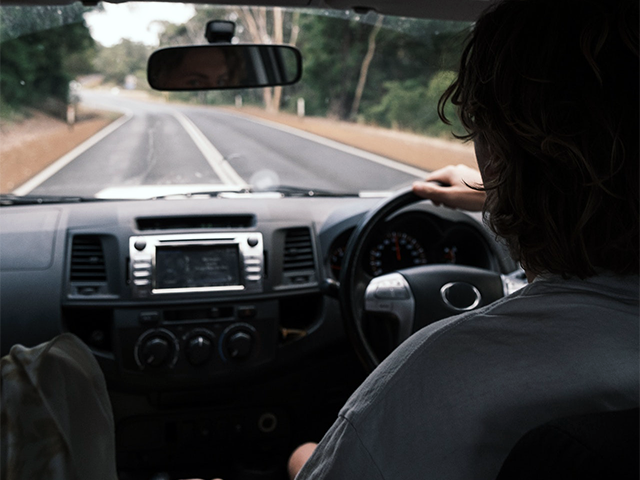 man_at_wheel_of_a_second_hand_car