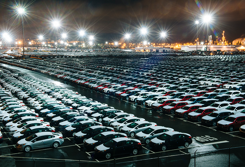 Electric car depreciation, large car parking lot filled with cars