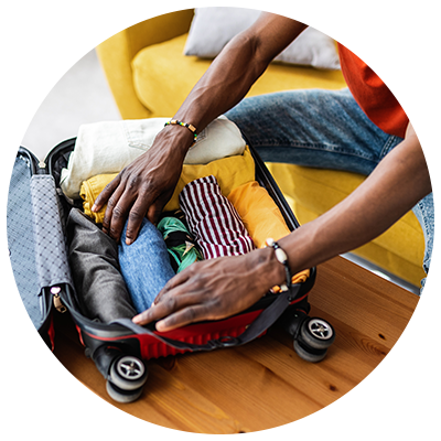 hand luggage only young man packing luggage