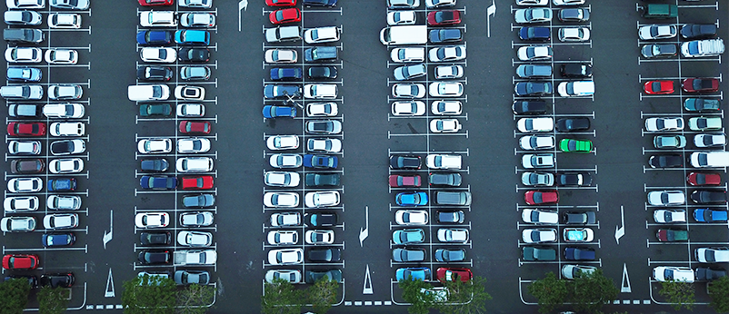 how to save money on petrol aerial view of car parking